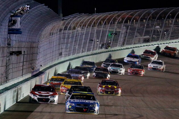 HOMESTEAD, FL - NOVEMBER 20:  Jimmie Johnson, driver of the #48 Lowe's Chevrolet, takes the checkered flag to win the NASCAR Sprint Cup Series Ford EcoBoost 400 and the 2016 NASCAR Sprint Cup Series Championship at Homestead-Miami Speedway on November 20, 2016 in Homestead, Florida.  (Photo by Chris Trotman/Getty Images)