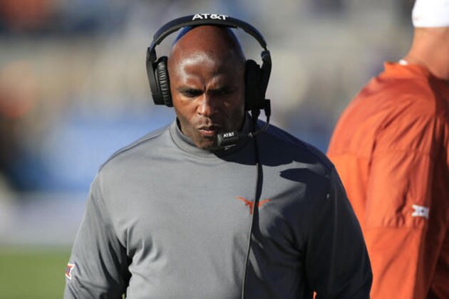 Texas head coach Charlie Strong walks the sideline during the first half of an NCAA college football game against Kansas in Lawrence, Kan., Saturday, Nov. 19, 2016. (AP Photo/Orlin Wagner)