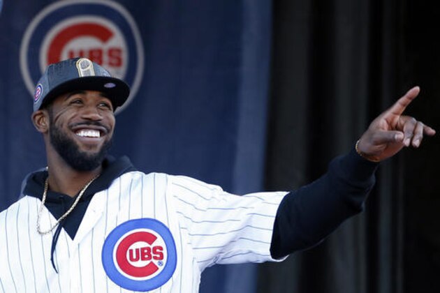 Chicago Cubs' Dexter Fowler smiles as he points during a celebration honoring the World Series champions at Grant Park in Chicago, Friday, Nov. 4, 2016. (AP Photo/Nam Y. Huh)