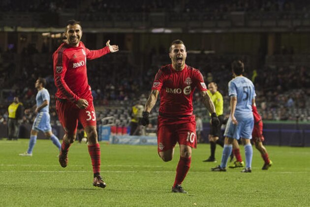 Toronto FC Sebastian Giovinco (10) center right, celebrates his goal during a MLS second leg eastern semifinals soccer match against New York City FC in New York, Sunday, Nov. 6, 2016. (AP Photo/Andres Kudacki)