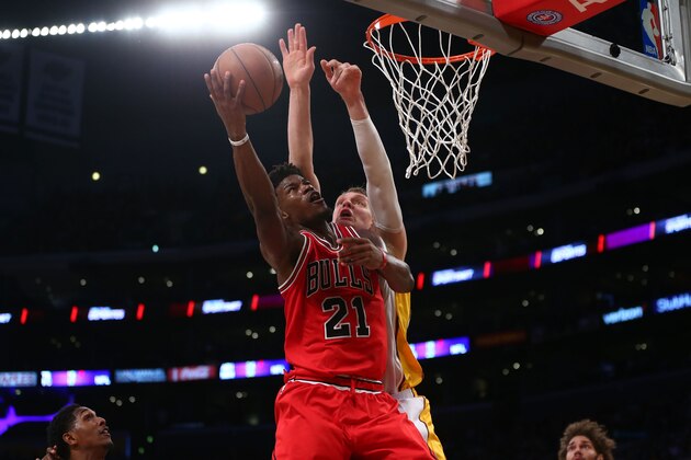 LOS ANGELES, CA - NOVEMBER 20: Jimmy Butler #21 of the Chicago Bulls goes up for the layup against Timofey Mozgov #20 of the Los Angeles Lakers during the first half of the NBA game at Staples Center on November 20, 2016 in Los Angeles, California. NOTE TO USER: User expressly acknowledges and agrees that, by downloading and or using this photograph, User is consenting to the terms and conditions of the Getty Images License Agreement.  (Photo by Victor Decolongon/Getty Images)