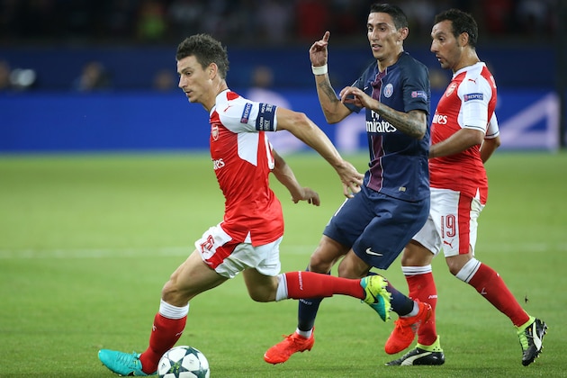 PARIS, FRANCE - SEPTEMBER 13: Laurent Koscielny of Arsenal, Angel Di Maria of PSG, Santi Cazorla of Arsenal in action during the UEFA Champions League group phase match between Paris Saint-Germain and Arsenal FC at Parc des Princes on September 13, 2016 in Paris, France. (Photo by Jean Catuffe/Getty Images)