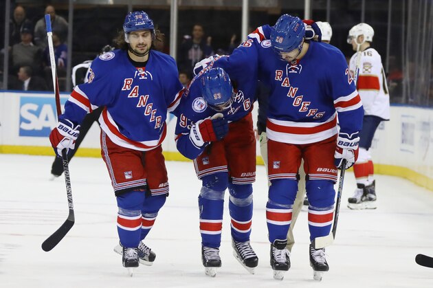 NEW YORK, NY - NOVEMBER 20:  Mats Zuccarello #36 and Chris Kreider #20 escourt Mika Zibanejad #93 of the New York Rangers off the ice after his injury during the third period against the Florida Panthers at Madison Square Garden on November 20, 2016 in New York City. The Panthers defeated the Rangers 3-2 in the shootout.  (Photo by Bruce Bennett/Getty Images)