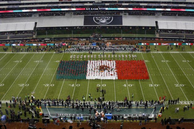 An image of the Mexican flag is seen as the Mexican national anthem is played before an NFL football game between the Oakland Raiders and the Houston Texans Monday, Nov. 21, 2016, in Mexico City. (AP Photo/Dario Lopez-Mills)