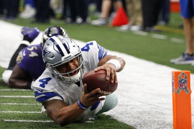 Dallas Cowboys quarterback Dak Prescott (4) leaps but falls shy of the end zone after being tripped up by Baltimore Ravens' Zach Orr in the first half of an NFL football game, Sunday, Nov. 20, 2016, in Arlington, Texas. (AP Photo/Michael Ainsworth)