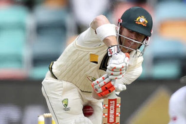 The ball gets past the bat of Australia's David Warner during their cricket test match against South Africa in Hobart, Australia, Monday, Nov. 14, 2016. (AP Photo/Rick Rycroft)