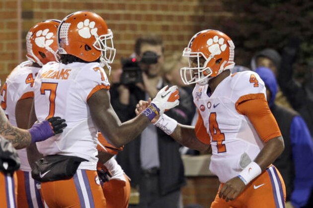 Clemson's Deshaun Watson (4) celebrates his touchdown run against Wake Forest with Mike Williams (7) in the first half of an NCAA college football game in Winston-Salem, N.C., Saturday, Nov. 19, 2016. (AP Photo/Chuck Burton)