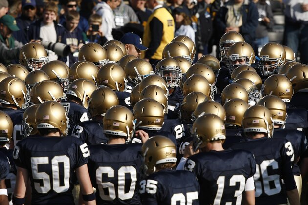 SOUTH BEND, IN - NOVEMBER 21: A group of Notre Dame Fighting Irish players huddle together before the game against the Connecticut Huskies at Notre Dame Stadium on November 21, 2009 in South Bend, Indiana. Connecticut won 33-30 in double overtime. (Photo by Joe Robbins/Getty Images)