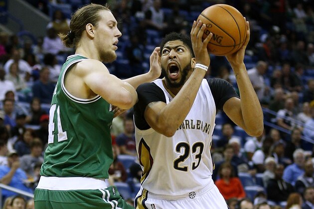 NEW ORLEANS, LA - NOVEMBER 14: Anthony Davis #23 of the New Orleans Pelicans drives against Kelly Olynyk #41 of the Boston Celtics during the second half of a game at the Smoothie King Center on November 14, 2016 in New Orleans, Louisiana. NOTE TO USER: User expressly acknowledges and agrees that, by downloading and or using this photograph, User is consenting to the terms and conditions of the Getty Images License Agreement. (Photo by Jonathan Bachman/Getty Images)