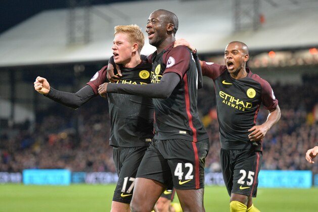 Manchester City's Ivorian midfielder Yaya Toure (C) celebrates with Manchester City's Belgian midfielder Kevin De Bruyne (L) and Manchester City's Brazilian midfielder Fernandinho (R) after scoring their second goal during the English Premier League football match between Crystal Palace and Manchester City at Selhurst Park in south London on November 19, 2016.
Manchester City won the game 2-1. / AFP / OLLY GREENWOOD / RESTRICTED TO EDITORIAL USE. No use with unauthorized audio, video, data, fixture lists, club/league logos or 'live' services. Online in-match use limited to 75 images, no video emulation. No use in betting, games or single club/league/player publications.  /         (Photo credit should read OLLY GREENWOOD/AFP/Getty Images)