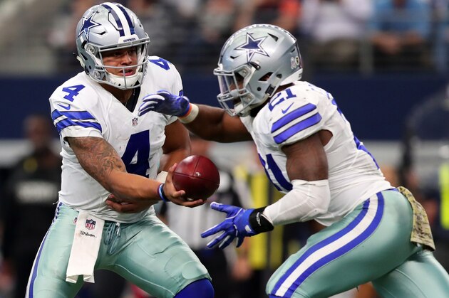 ARLINGTON, TX - NOVEMBER 20:   Dak Prescott #4 hands off to Ezekiel Elliott #21 of the Dallas Cowboys during the second half against the Baltimore Ravens at AT&T Stadium on November 20, 2016 in Arlington, Texas.  (Photo by Tom Pennington/Getty Images)