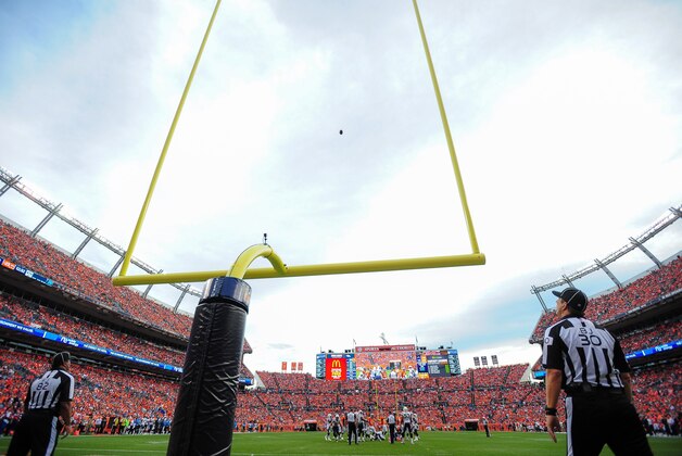 DENVER, CO - OCTOBER 30:  Field judge Buddy Horton #82 and back judge Todd Prukop #30 watch in a general view as an extra point attempt goes up in the fourth quarter of a game between the Denver Broncos and the San Diego Chargers at Sports Authority Field at Mile High on October 30, 2016 in Denver, Colorado. (Photo by Dustin Bradford/Getty Images)