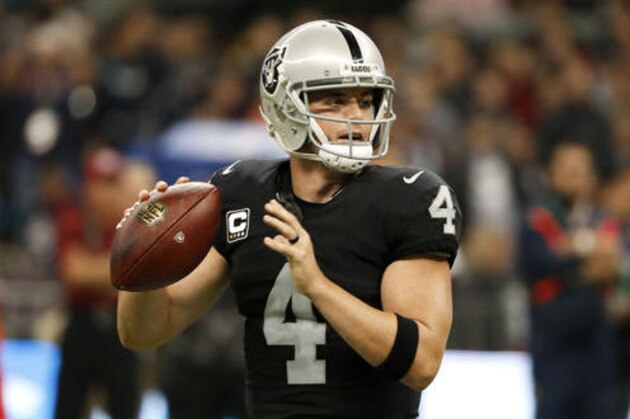 Oakland Raiders quarterback Derek Carr looks to throw a pass during the first half of an NFL football game against the Houston Texans Monday, Nov. 21, 2016, in Mexico City. (AP Photo/Eduardo Verdugo)