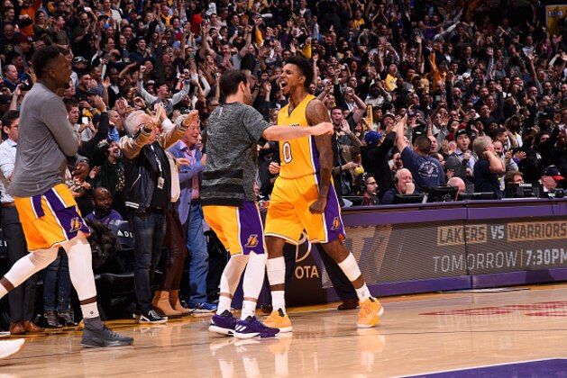 LOS ANGELES, CA - NOVEMBER 22:  Nick Young #0 of the Los Angeles Lakers celebrates with his teammates after scoring the game winning shot against the Oklahoma City Thunder on November 22, 2016 at STAPLES Center in Los Angeles, California. NOTE TO USER: User expressly acknowledges and agrees that, by downloading and/or using this Photograph, user is consenting to the terms and conditions of the Getty Images License Agreement. Mandatory Copyright Notice: Copyright 2016 NBAE (Photo by Andrew D. Bernstein/NBAE via Getty Images)