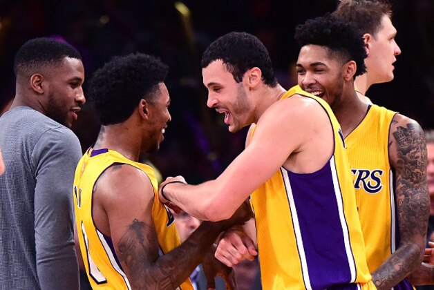 LOS ANGELES, CA - NOVEMBER 22:  Nick Young #0 of the Los Angeles Lakers celebrates a 111-109 win over the Oklahoma City Thunder with Larry Nance Jr. #7, Brandon Ingram #14 and Tarik Black #28 at Staples Center on November 22, 2016 in Los Angeles, California.  NOTE TO USER: User expressly acknowledges and agrees that, by downloading and or using this photograph, User is consenting to the terms and conditions of the Getty Images License Agreement.  (Photo by Harry How/Getty Images)