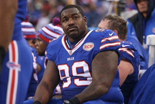 ORCHARD PARK, NY - DECEMBER 14: Marcell Dareus #99 of the Buffalo Bills looks on from the bench during NFL game action against the Green Bay Packers at Ralph Wilson Stadium on December 14, 2014 in Orchard Park, New York. (Photo by Tom Szczerbowski/Getty Images)