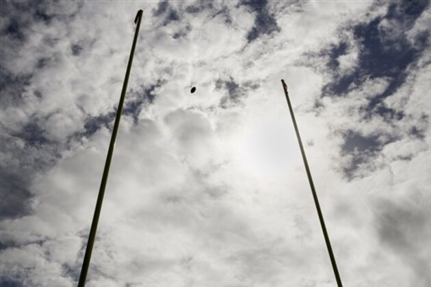 A football flies through the goalposts during warm ups before an NFL football game between the Baltimore Ravens and the Cincinnati Bengals in Baltimore, Sunday, Sept. 27, 2015. (AP Photo/Patrick Semansky)