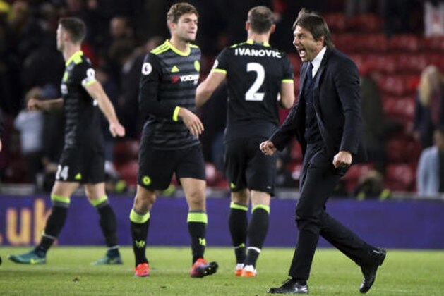 Chelsea's manager Antonio Conte celebrates the victory over Middlesbrough at the end of the English Premier League soccer match between Middlesbrough and Chelsea at the Riverside stadium, Middlesbrough, England, Sunday, Nov. 20, 2016. (AP Photo/Scott Heppell)