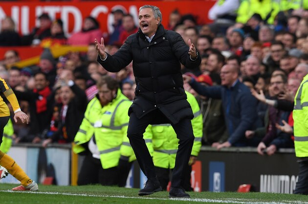 Manchester United's Portuguese manager Jose Mourinho reacts after Arsenal's Spanish defender Nacho Monreal challenged Manchester United's Ecuadorian midfielder Antonio Valencia in the area, during the English Premier League football match between Manchester United and Arsenal at Old Trafford in Manchester, north west England, on November 19, 2016. / AFP / Paul ELLIS / RESTRICTED TO EDITORIAL USE. No use with unauthorized audio, video, data, fixture lists, club/league logos or 'live' services. Online in-match use limited to 75 images, no video emulation. No use in betting, games or single club/league/player publications.  /         (Photo credit should read PAUL ELLIS/AFP/Getty Images)