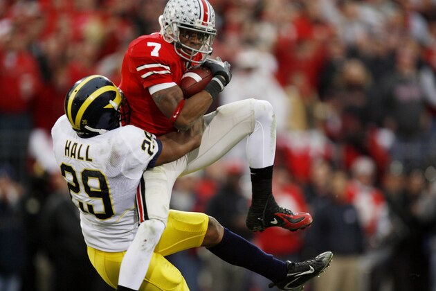 COLUMBUS, OH - NOVEMBER 18:  Wide receiver Ted Ginn Jr. #7 of the Ohio State Buckeyes makes a catch against cornerback Leon Hall #29 of the Michigan Wolverines on November 18, 2006 at Ohio Stadium in Columbus, Ohio.  Ohio State won 42-39.  (Photo by Gregory Shamus/Getty Images)