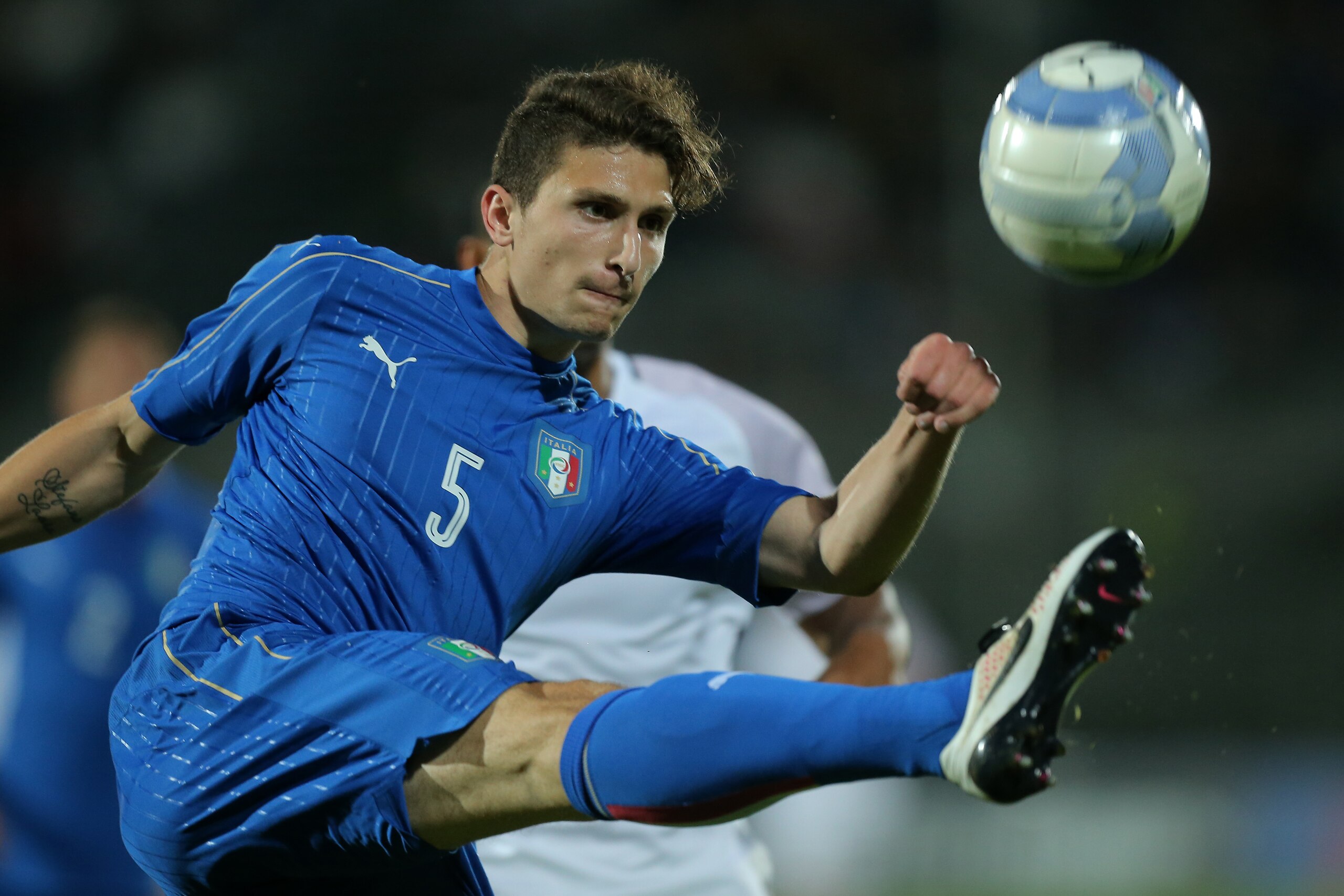 Italy's defender Mattia Caldara kicks the ball during the U21 international friendly football match between Italy and France at the Pierluigi Penzo Stadium in Venice, Italy, on June 2, 2016. / AFP / MARCO BERTORELLO        (Photo credit should read MARCO BERTORELLO/AFP/Getty Images)