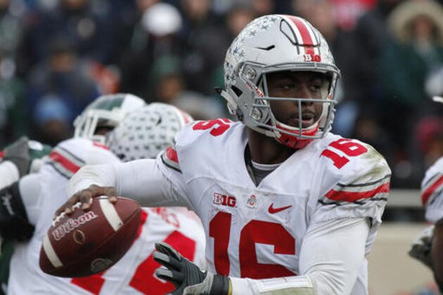 Ohio State quarterback J.T. Barrett looks to throw against Michigan State during the fourth quarter half of an NCAA college football game, Saturday, Nov. 19, 2016, in East Lansing, Mich. Ohio State won 17-16. (AP Photo/Al Goldis)