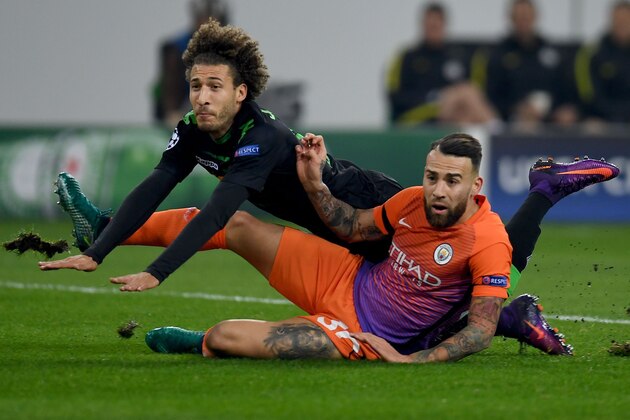 Moenchengladbach's US defender Fabian Johnson and Manchester City's Argentinian defender Nicolas Otamendi vie for the ball during the UEFA group C Champions League football match between Borussia Moenchengladbach and Manchester City on November 23, 2016 in Moenchengladbach, western Germany. / AFP / PATRIK STOLLARZ        (Photo credit should read PATRIK STOLLARZ/AFP/Getty Images)