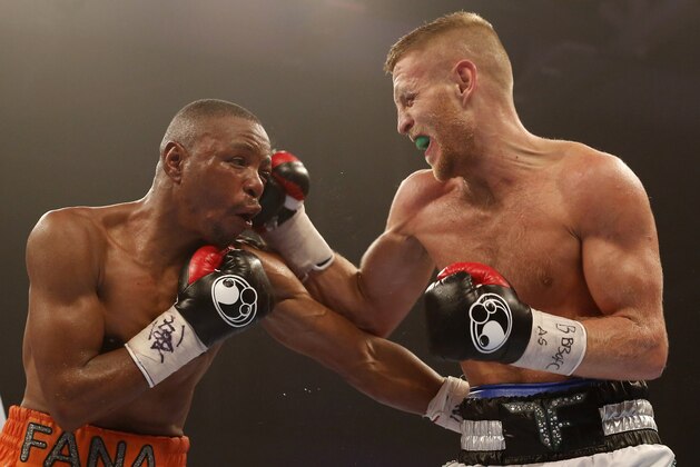 CARDIFF, WALES - JULY 16: Terry Flanagan of Great Britain (R) in action against Mzonke Fana of South Africa during their WBO World Lightweight Championship bout at Cardiff Ice Arena on July 16, 2016 in Cardiff, Wales. (Photo by Julian Herbert/Getty Images)