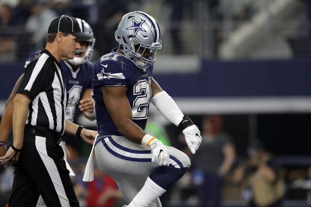 ARLINGTON, TX - NOVEMBER 24:   Ezekiel Elliott #21 of the Dallas Cowboys celebrates after scoring a touchdown during the first quarter against the Washington Redskins at AT&T Stadium on November 24, 2016 in Arlington, Texas.  (Photo by Ronald Martinez/Getty Images)