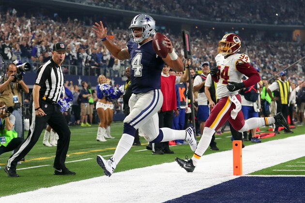 ARLINGTON, TX - NOVEMBER 24:   Dak Prescott #4 of the Dallas Cowboys rushes for a touchdown during the fourth quarter against the Washington Redskins at AT&T Stadium on November 24, 2016 in Arlington, Texas.  (Photo by Tom Pennington/Getty Images)