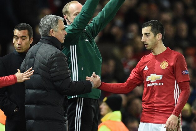 Manchester United's Armenian midfielder Henrikh Mkhitaryan (R) shakes hands with Manchester United's Portuguese manager Jose Mourinho (L) as he is substituted during the UEFA Europa League group A football match between Manchester United and Feyenoord at Old Trafford stadium in Manchester, north-west England, on November 24, 2016. / AFP / Oli SCARFF        (Photo credit should read OLI SCARFF/AFP/Getty Images)