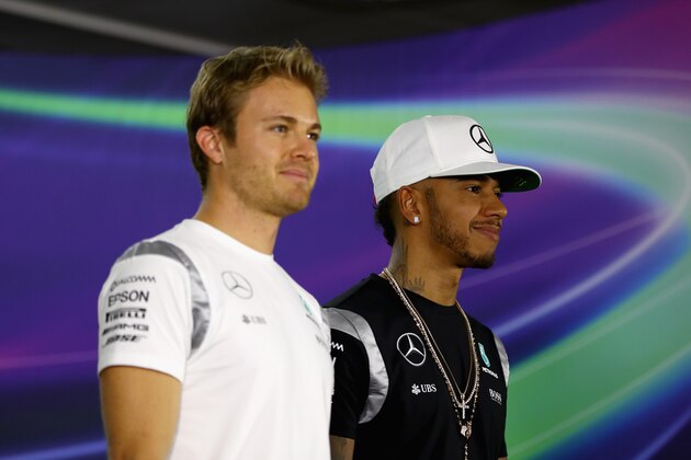 ABU DHABI, UNITED ARAB EMIRATES - NOVEMBER 24:  World Championship contenders Lewis Hamilton of Great Britain and Mercedes GP and Nico Rosberg of Germany and Mercedes GP pose for a photo before conducting a press conference during previews for the Abu Dhabi Formula One Grand Prix at Yas Marina Circuit on November 24, 2016 in Abu Dhabi, United Arab Emirates.  (Photo by Clive Mason/Getty Images)
