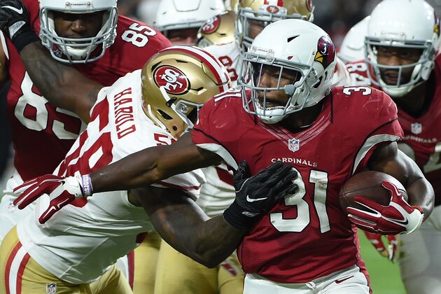 GLENDALE, AZ - NOVEMBER 13:  David Johnson #31 of the Arizona Cardinals attempts to break a tackle by Eli Harold #58 of the San Francisco 49ers at University of Phoenix Stadium on November 13, 2016 in Glendale, Arizona. (Photo by Norm Hall/Getty Images)