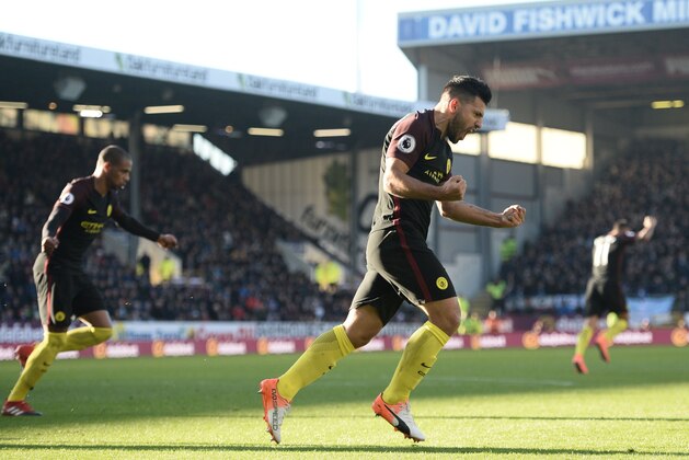 Manchester City's Argentinian striker Sergio Aguero (C) celebrates after scoring their first goal during the English Premier League football match between Burnley and Manchester City at Turf Moor in Burnley, north west England on November 26, 2016. / AFP / Oli SCARFF / RESTRICTED TO EDITORIAL USE. No use with unauthorized audio, video, data, fixture lists, club/league logos or 'live' services. Online in-match use limited to 75 images, no video emulation. No use in betting, games or single club/league/player publications.  /         (Photo credit should read OLI SCARFF/AFP/Getty Images)