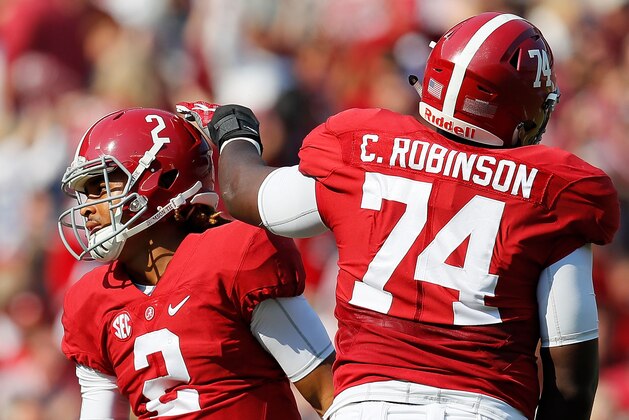 TUSCALOOSA, AL - NOVEMBER 12:  Jalen Hurts #2 of the Alabama Crimson Tide reacts with Cam Robinson #74 after passing for a touchdown against the Mississippi State Bulldogs at Bryant-Denny Stadium on November 12, 2016 in Tuscaloosa, Alabama.  (Photo by Kevin C. Cox/Getty Images)