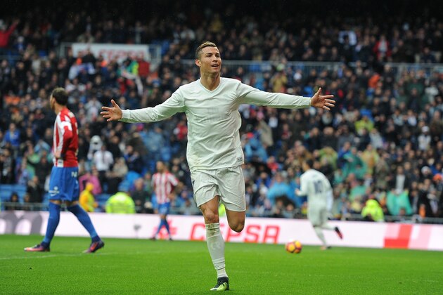 MADRID, SPAIN - NOVEMBER 26:  Cristiano Ronaldo of Real Madrid celebrates after scoring Real's 2nd goal from during the La Liga match between Real Madrid CF and Real Sporting de Gijon at Estadio Santiago Bernabeu on November 26, 2016 in Madrid, Spain.  (Photo by Denis Doyle/Getty Images)