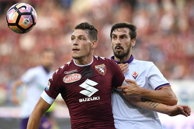 TURIN, ITALY - OCTOBER 02:  Andrea Belotti (L) of FC Torino is challenged by Davide Astori of ACF Fiorentina during the Serie A match between FC Torino and ACF Fiorentina at Stadio Olimpico di Torino on October 2, 2016 in Turin, Italy.  (Photo by Valerio Pennicino/Getty Images)