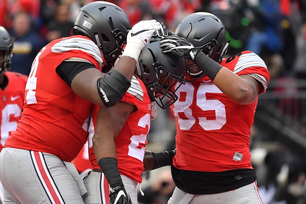 COLUMBUS, OH - NOVEMBER 26:   Mike Weber #25 of the Ohio State Buckeyes celebrates with teammates after scoring a touchdown during the second half against the Michigan Wolverines at Ohio Stadium on November 26, 2016 in Columbus, Ohio.  (Photo by Jamie Sabau/Getty Images)