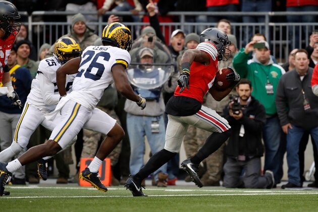 COLUMBUS, OH - NOVEMBER 26:   Curtis Samuel #4 of the Ohio State Buckeyes scores the winning touchdown in double overtime against the Michigan Wolverines at Ohio Stadium on November 26, 2016 in Columbus, Ohio.  (Photo by Gregory Shamus/Getty Images)