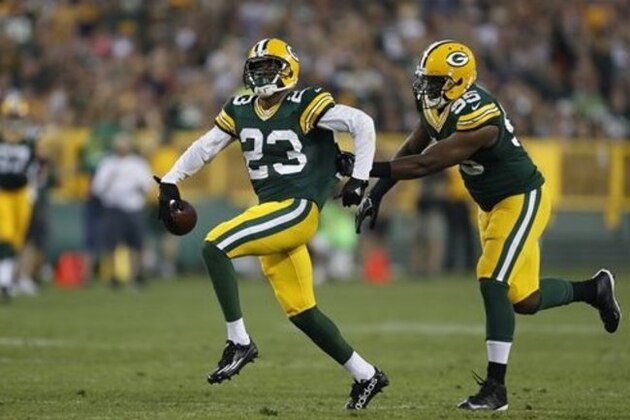 Green Bay Packers cornerback Damarious Randall (23), left, celebrates an interception with teammate Green Bay Datone Jones (95)during the first half of an NFL preseason football game against the Oakland Raiders in Green Bay, Wis., Thursday, Aug. 18, 2016. (AP Photo/Matt Ludtke)