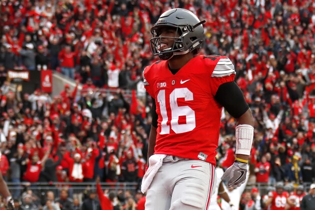 COLUMBUS, OH - NOVEMBER 26:   J.T. Barrett #16 of the Ohio State Buckeyes celebrates after rushing for a touchdown in overtime against the Michigan Wolverines at Ohio Stadium on November 26, 2016 in Columbus, Ohio.  (Photo by Gregory Shamus/Getty Images)