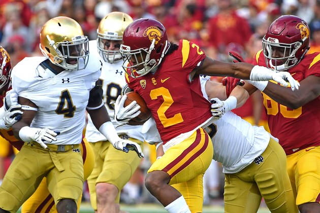 LOS ANGELES, CA - NOVEMBER 26:     Adoree' Jackson #2 of the USC Trojans gets to the 15 yard line on a kick off return before he is stopped by Te'von Coney #4 of the Notre Dame Fighting Irish in the first half of the game at the Los Angeles Memorial Coliseum on November 26, 2016 in Los Angeles, California.  (Photo by Jayne Kamin-Oncea/Getty Images)