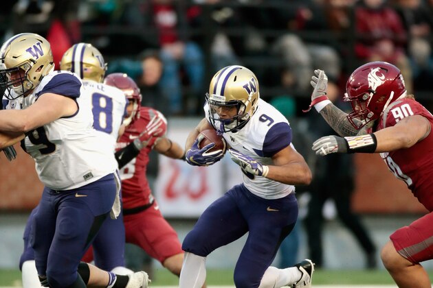 PULLMAN, WA - NOVEMBER 25:  Myles Gaskin #9 of the Washington Huskies moves the ball against the Washington State Cougars in the second half of the 109th Apple Cup at Martin Stadium on November 25, 2016 in Pullman, Washington.  Washington defeated Washington State 45-17.  (Photo by William Mancebo/Getty Images)