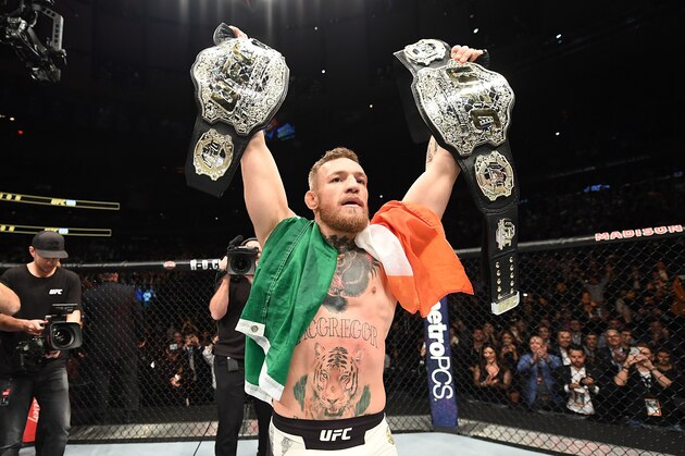NEW YORK, NY - NOVEMBER 12:  UFC lightweight and featherweight champion Conor McGregor of Ireland celebrates after defeating Eddie Alvarez in their UFC lightweight championship fight during the UFC 205 event at Madison Square Garden on November 12, 2016 in New York City. (Photo by Jeff Bottari/Zuffa LLC/Zuffa LLC via Getty Images)