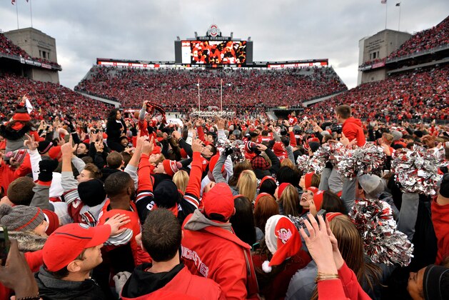 COLUMBUS, OH - NOVEMBER 26:   Ohio State Buckeyes fans celebrate after defeating the Michigan Wolverines at Ohio Stadium on November 26, 2016 in Columbus, Ohio.  (Photo by Jamie Sabau/Getty Images)