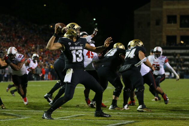 BOULDER, CO - NOVEMBER 26:  Quarterback Sefo Liufau #13 of the Colorado Buffaloes completes a pass from the end zone during the third quarter against the Utah Utes at Folsom Field on November 26, 2016 in Boulder, Colorado. Colorado defeated Utah 27-22 and win the Pac-12 South. The Buffaloes will play Washington next week in the Pac-12 Championship. (Photo by Justin Edmonds/Getty Images)