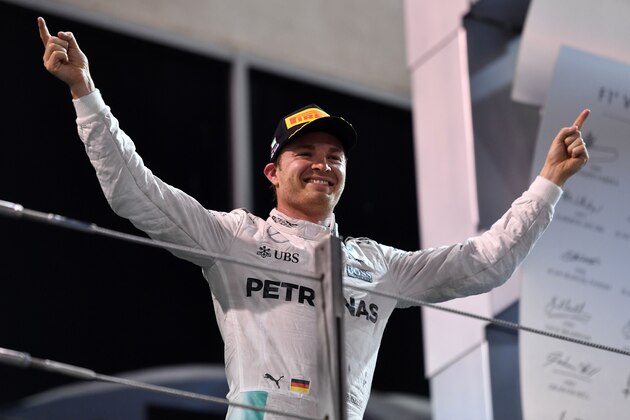 Mercedes AMG Petronas F1 Team's German driver Nico Rosberg celebrates at the end of the Abu Dhabi Formula One Grand Prix at the Yas Marina circuit on November 27, 2016.
Nico Rosberg won his maiden Formula One world title by securing second place behind his Mercedes arch-rival Lewis Hamilton in the Abu Dhabi Grand Prix. / AFP / Andrej ISAKOVIC        (Photo credit should read ANDREJ ISAKOVIC/AFP/Getty Images)