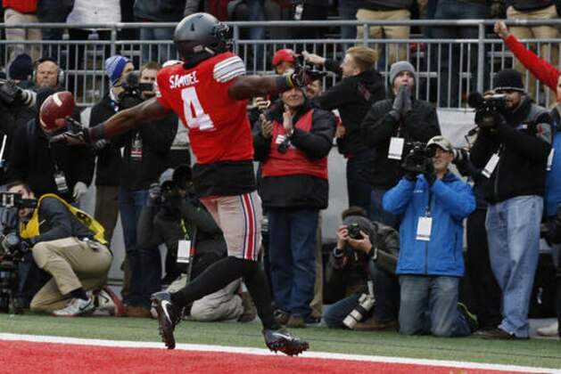 Ohio State running back Curtis Samuel celebrates his touchdown against Michigan during the second overtime of an NCAA college football game Saturday, Nov. 26, 2016, in Columbus, Ohio. Ohio State beat Michigan 30-27 in double overtime. (AP Photo/Jay LaPrete)