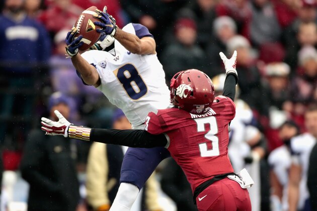 PULLMAN, WA - NOVEMBER 25:  Dante Pettis #8 of the Washington Huskies catches a pass against Darrien Molton #3 of the Washington State Cougars in the first half of the 109th Apple Cup at Martin Stadium on November 25, 2016 in Pullman, Washington.  (Photo by William Mancebo/Getty Images)