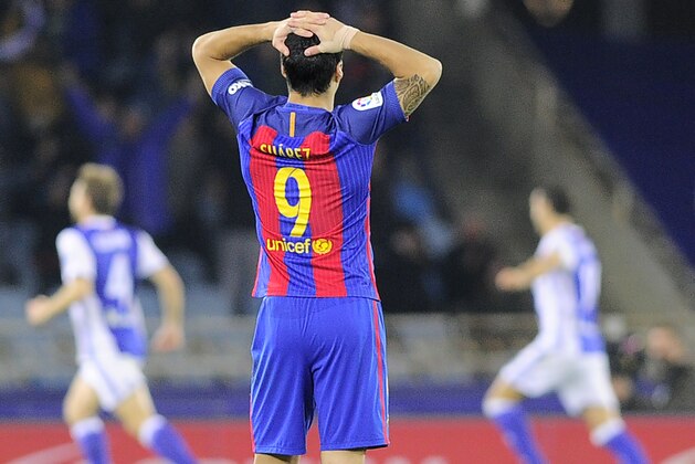 Barcelona's Uruguayan forward Luis Suarez stands after Real Sociedad scored a goal during the Spanish league football match Real Sociedad vs FC Barcelona at the Anoeta stadium in San Sebastian, on November 27, 2016. / AFP / ANDER GILLENEA        (Photo credit should read ANDER GILLENEA/AFP/Getty Images)